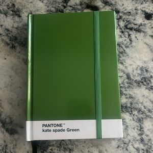 Kate Spade notebook that is color of 2023 green Pantone color called Kate Spade.